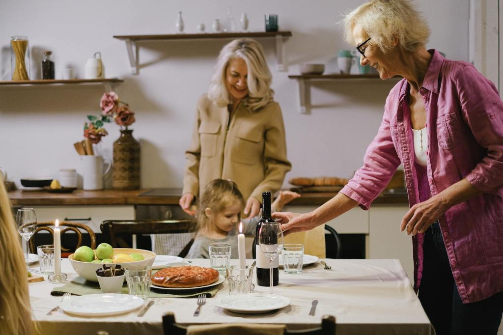 woman putting down phone family dinner