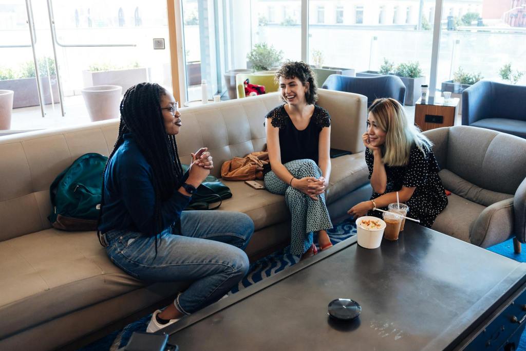 women friends talking coffee