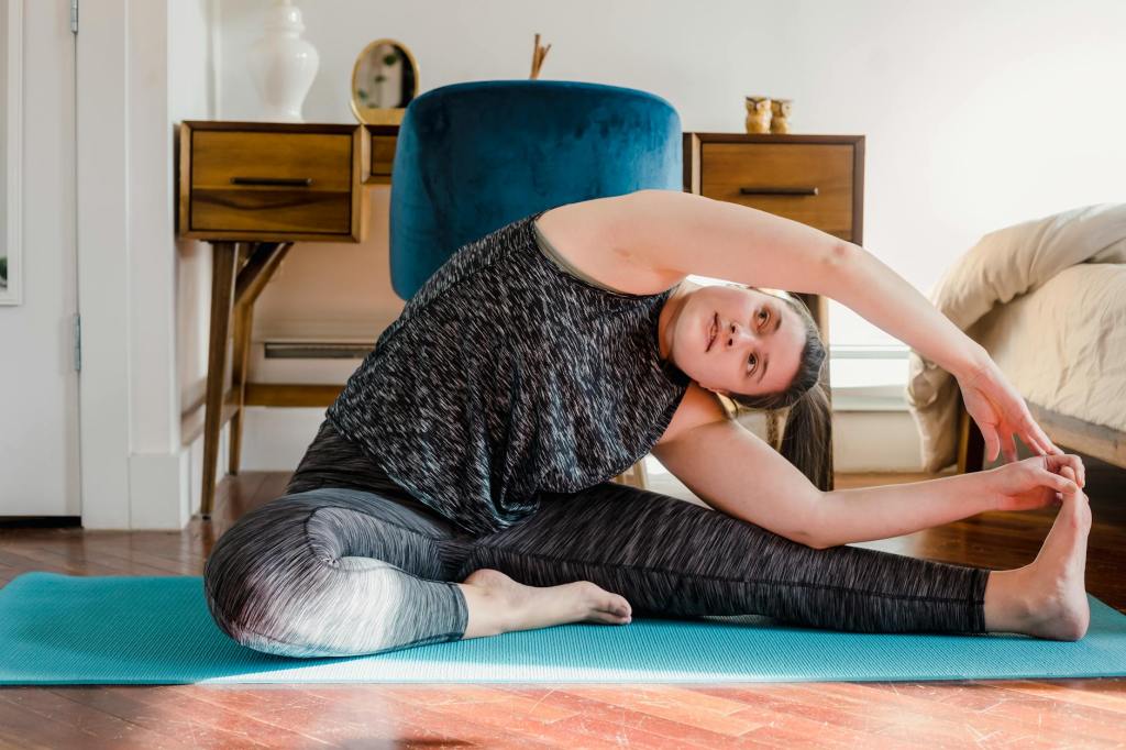 woman stretching morning home