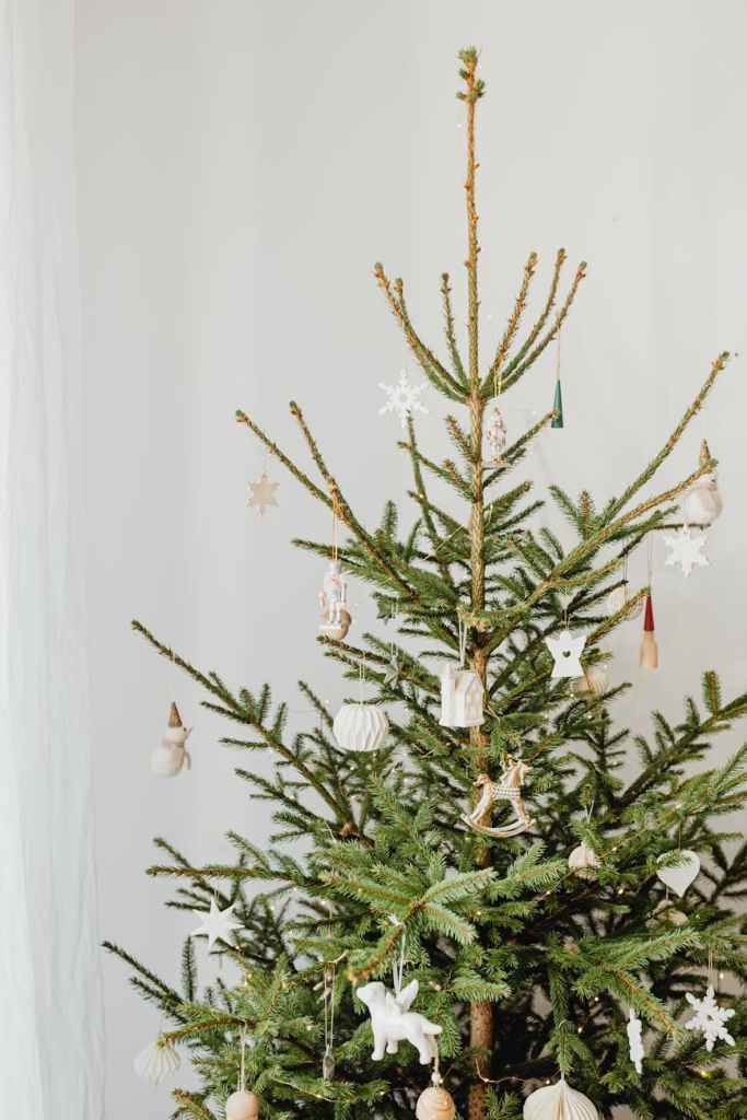 Simple, minimalist holiday decorations - one small tree, cozy atmosphere