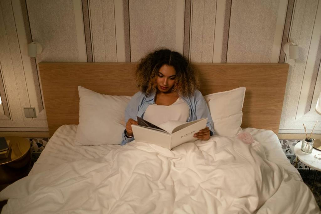 Women reading in bed at night with soft lighting