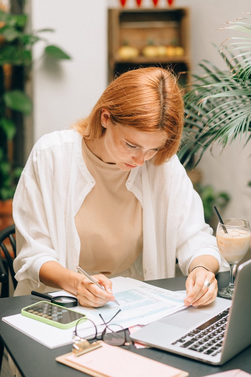 Mom sitting at a table working with a workbook guide