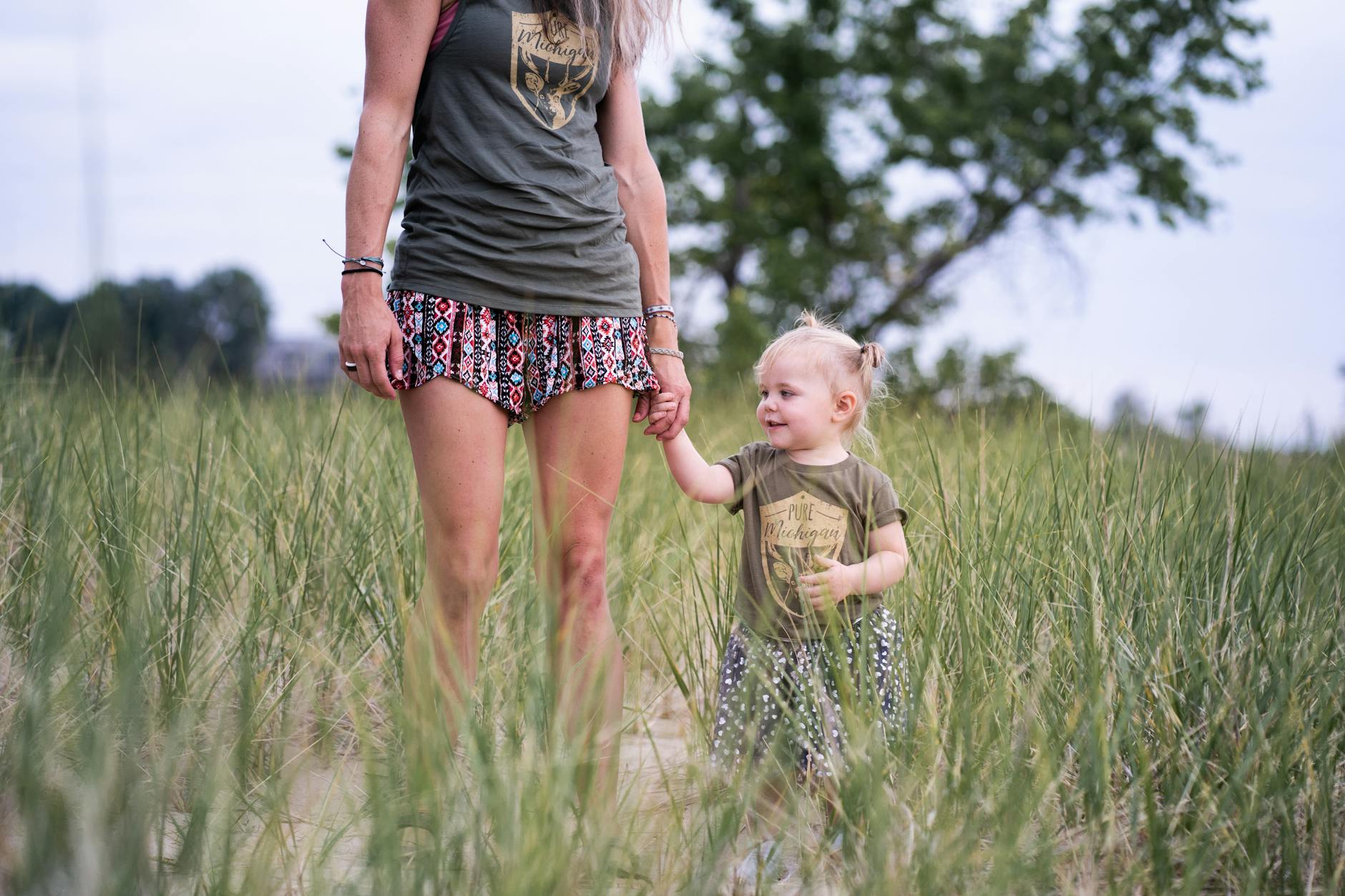 mom walking with daughter at dusk
