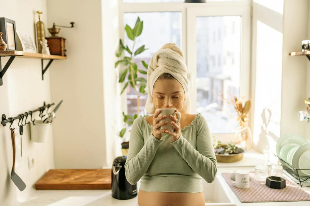 woman deep breathing kitchen with a cup of coffee