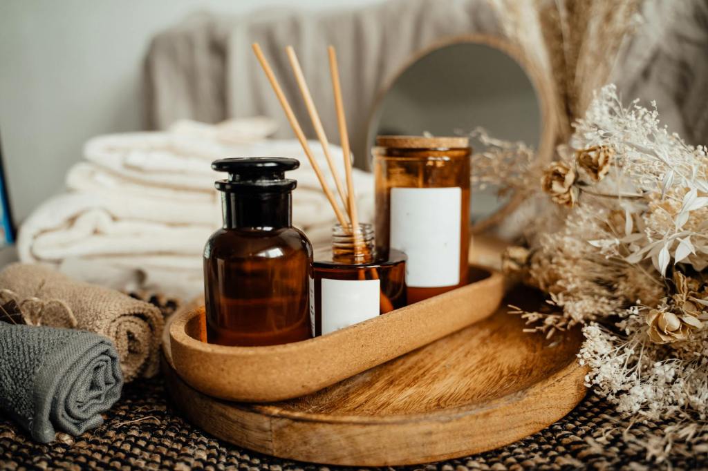 A diffuser on a bedside table with soft background
